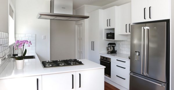 Modern white kitchen with black accents | Jag Kitchens